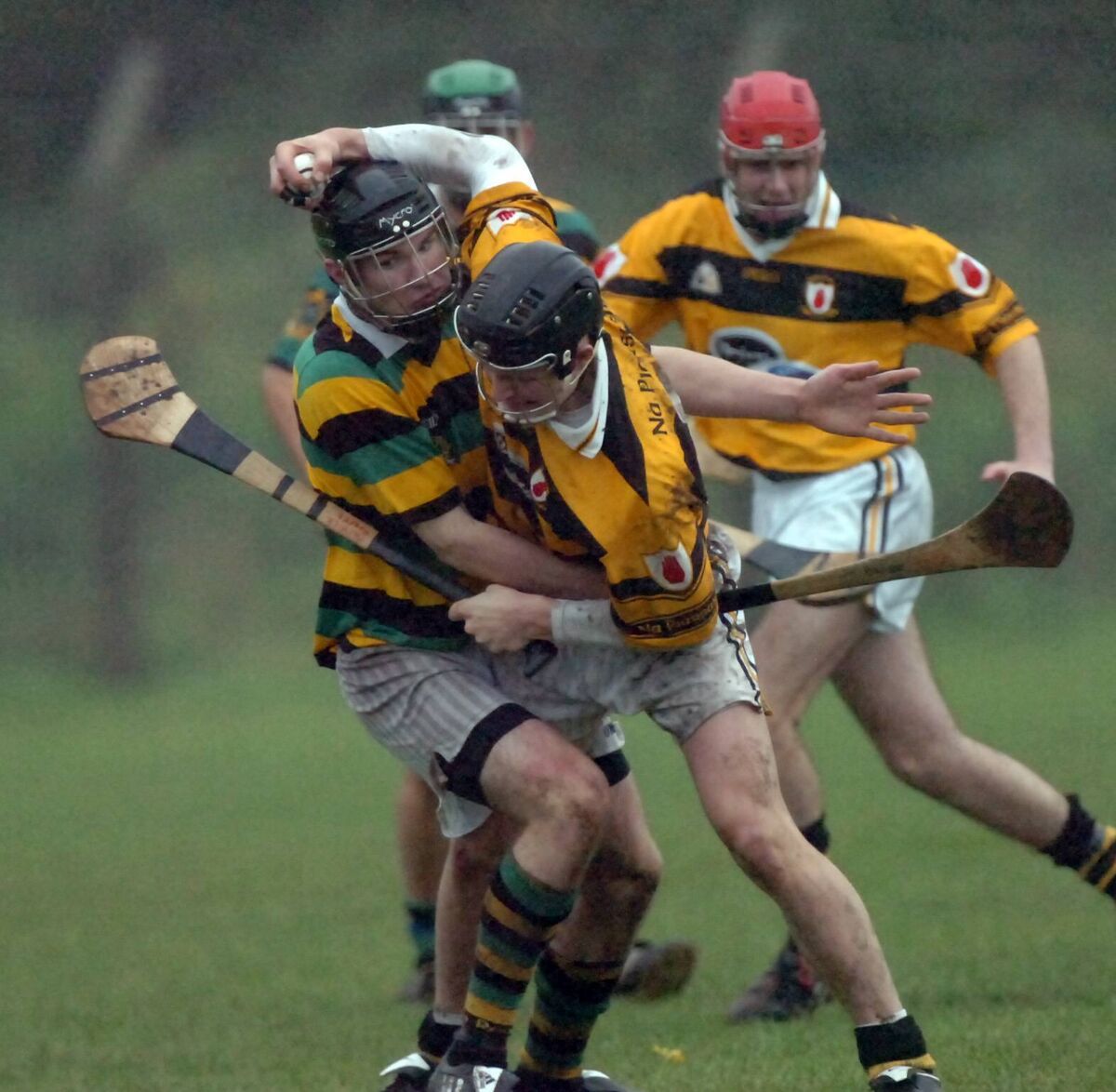 Na Piarsaigh's Pa O'Rourke keeping possession as he is caught by the Glen's Dean Brosnan during an U21 clash. Picture: Richard Mills.