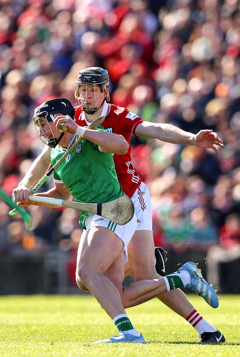Limerick's Gearoid Hegarty drives at Robert Downey of Cork in Sunday's league final. Picture: INPHO/Tom O’Hanlon