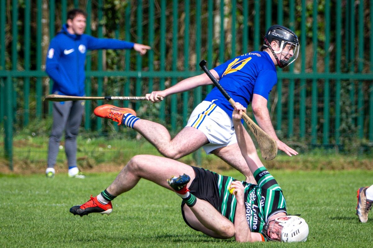 Douglas' Cillian O’Donovan lands heavily with the sliotar in his paw against Barrs. Picture: Chani Anderson