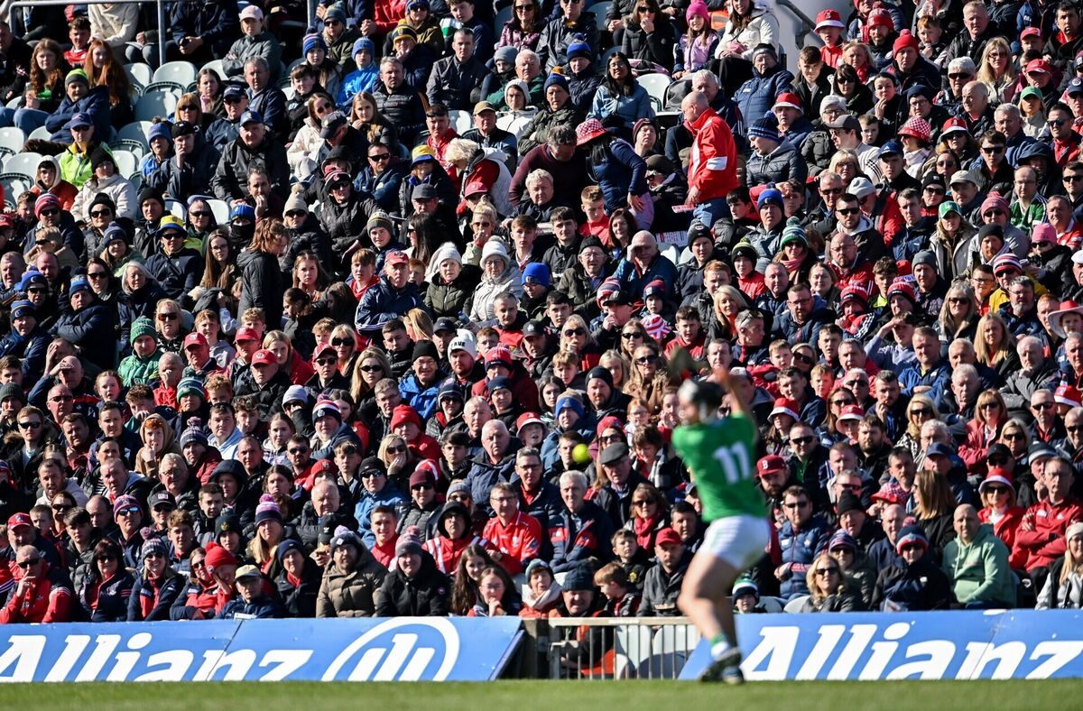 Supporters look on as Aidan O'Connor of Limerick takes a free against Cork. Picture: Ben McShane/Sportsfile