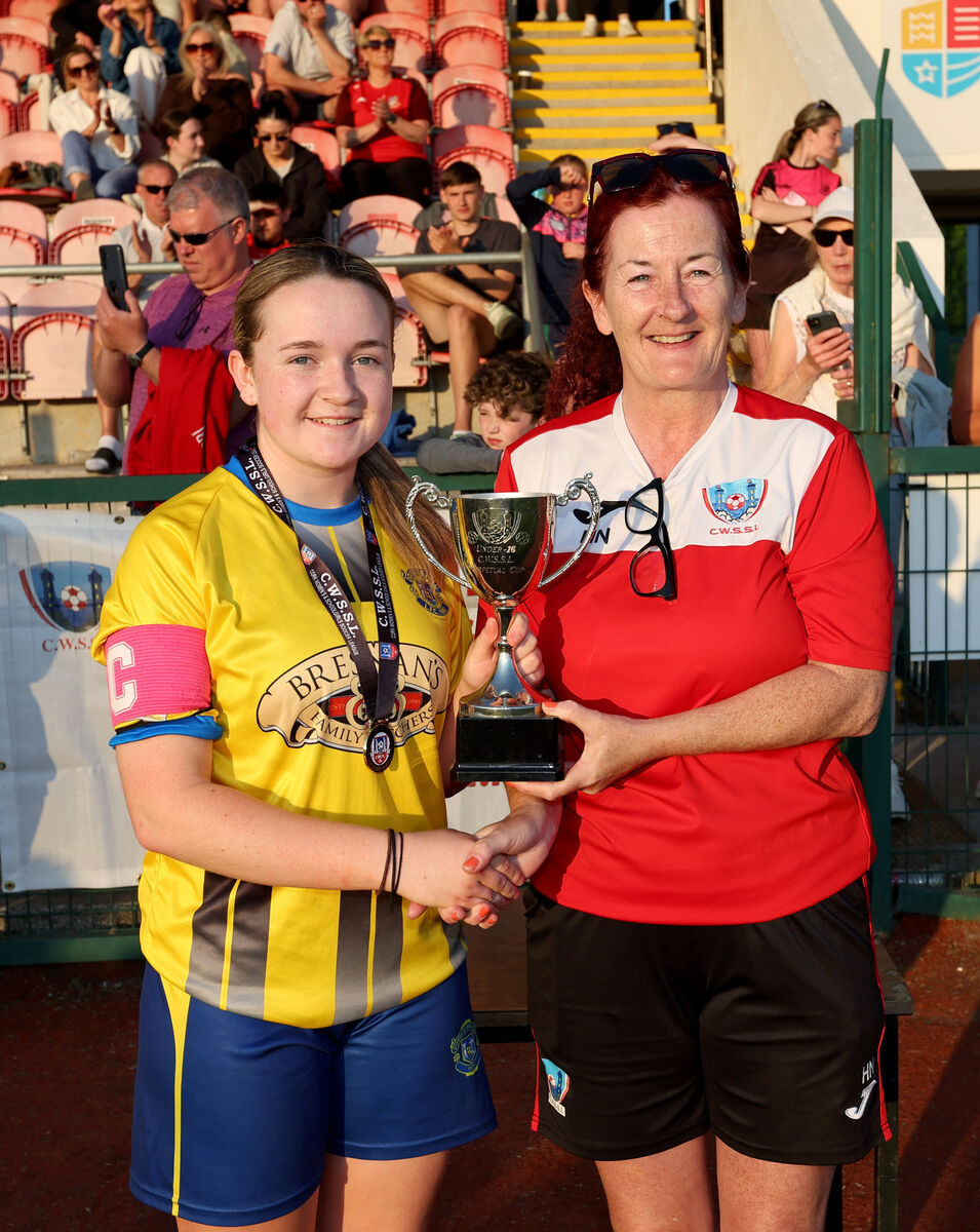  Ruby Lester, Douglas Hall U16 captain, receives the cup from Helen Noonan, CWSSL, last May. Picture: Jim Coughlan.