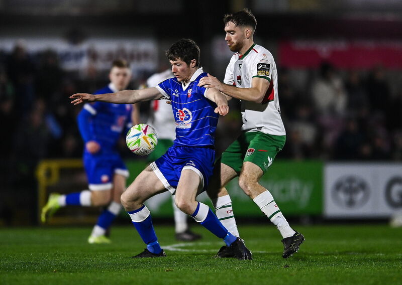 Ben Feeney of Treaty United in action against Conor Drinan of Cork City. Picture: Matt Browne/Sportsfile Ben Feeney of Treaty United in action against Conor Drinan of Cork City. Picture: Matt Browne/Sportsfile