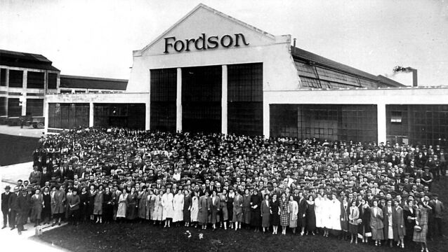 <p>THE STORY OF US: Hundreds of workers outside the Ford factory in Cork in 1926, which was making parts for the Model T car at the time</p>