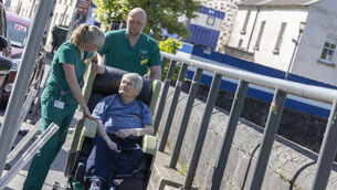 <p>Patient Adrian Melamphy, Mayfield, with Mercy University Hospital staff Ruth Swanton and James Deasy, in one of six high-support therapeutic seats being used at Mercy University Hospital Cork. Picture: Clare Keogh</p>