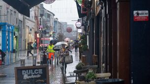 <p>A rainy day on Oliver Plunkett Street in Cork city. Picture Chani Anderson. </p>