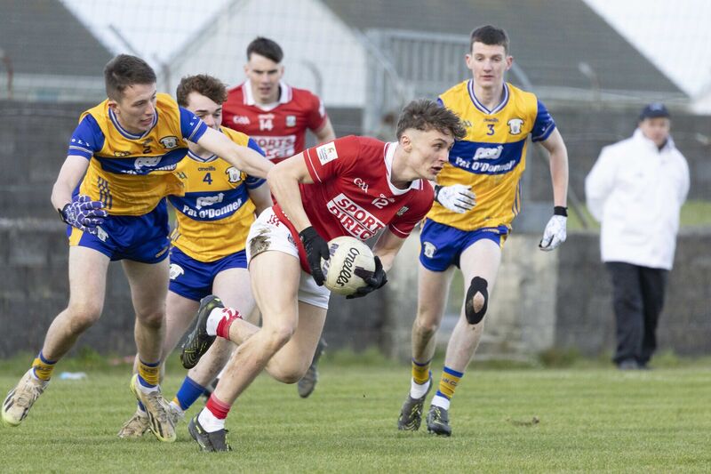 Cork's Gary Holland and Clare's Aidan Weaver and Aaron Killeen in action. Picture: Eamon Ward Cork's Gary Holland and Clare's Aidan Weaver and Aaron Killeen in action. Picture: Eamon Ward