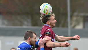 <p>Cobh Ramblers' Rhys Kelly-Noonan gets above Treaty United's Mark Walsh. Picture: Eddie O'Hare</p>