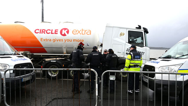 <p> Fuel trucks Whitegate oil refinery under Garda escort on Saturday afternoon. Picture: Larry Cummins</p>