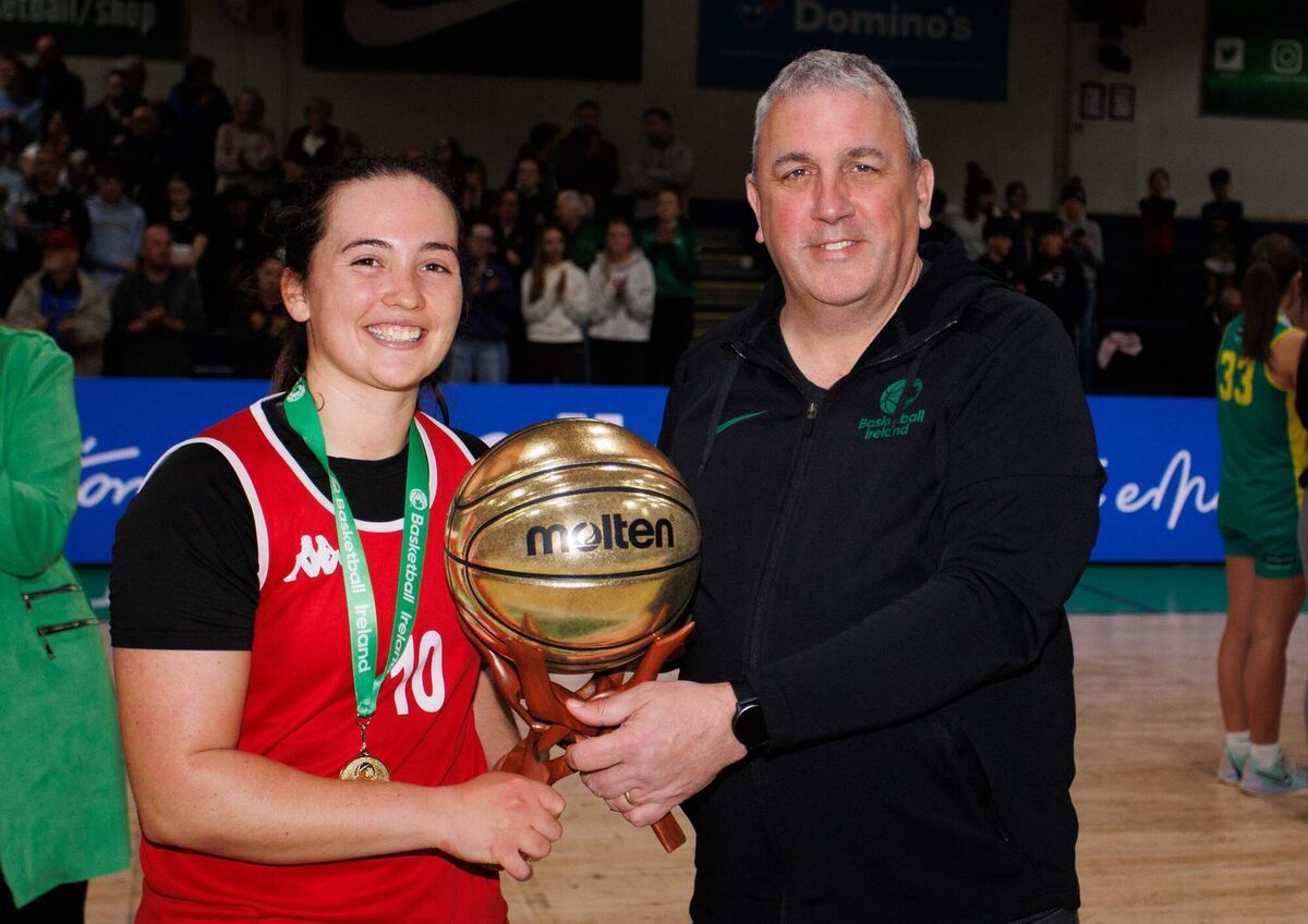 Fr Mathews BC’s Amy Corkey is presented with the MVP award by John Walsh, Basketball Ireland National League Manager 
