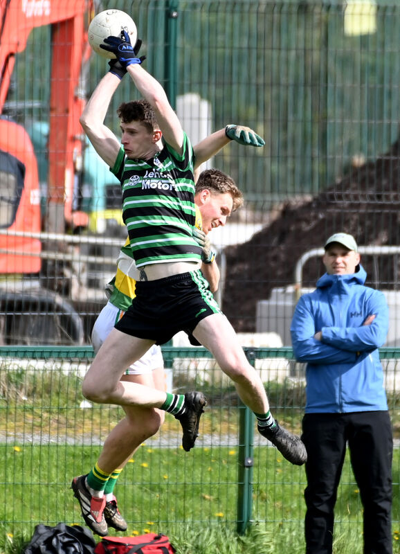 Douglas' Adam Cantwell and Carbery Rangers' Cian Daly go high for the ball. Picture: Eddie O'Hare