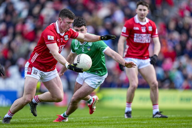 Mark Cronin of Cork kicks a point against Limerick. Picture: INPHO/James Lawlor