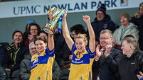 Clare Hehir and Abby Walsh lift the trophy 12/4/2026