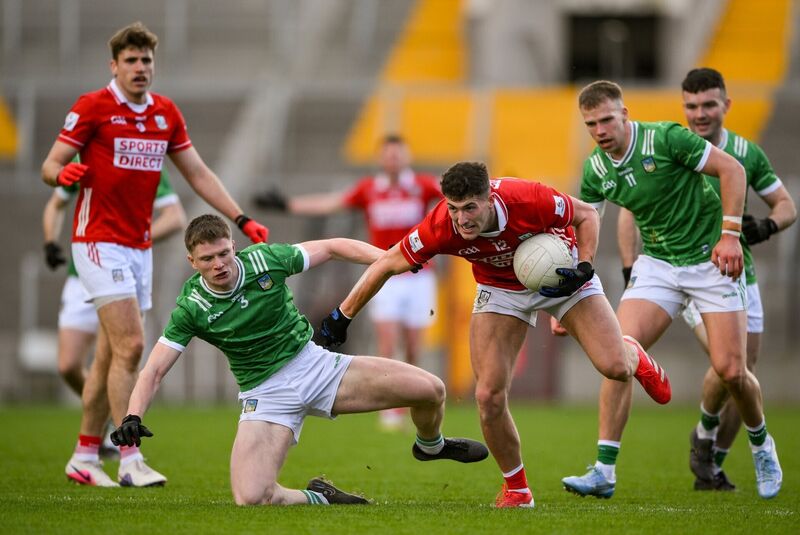 Seán McDonnell of Cork is tackled by Cormac Woulfe of Limerick. Picture: Brendan Moran/Sportsfile