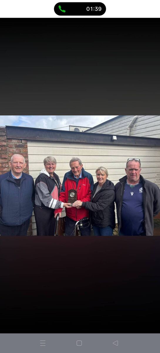 Cork County Boxing Board Officers, Michael O'Brien, Aine McLaughlin, Louise Forde, and John Wiseman make a presentation to Mick Devane, on his 95th birthday 
