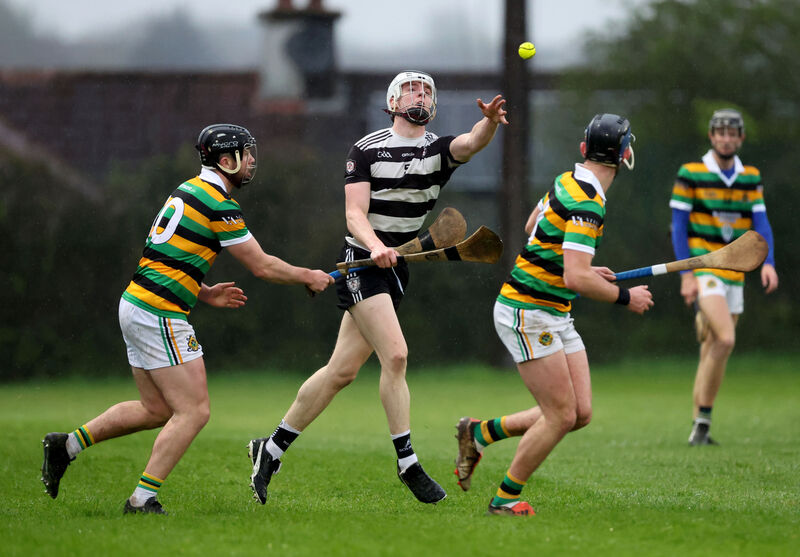 Midleton's Evan McGrath brings the ball out of defence, shadowed by Glen Rovers paid Gearóid Mulcahy and Jake Brosnan. Picture: Jim Coughlan Midleton's Evan McGrath brings the ball out of defence, shadowed by Glen Rovers paid Gearóid Mulcahy and Jake Brosnan. Picture: Jim Coughlan