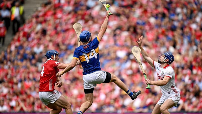 John McGrath of Tipperary past Cork goalkeeper Patrick Collins and Seán O'Donoghue of Cork. Picture: Seb Daly/Sportsfile