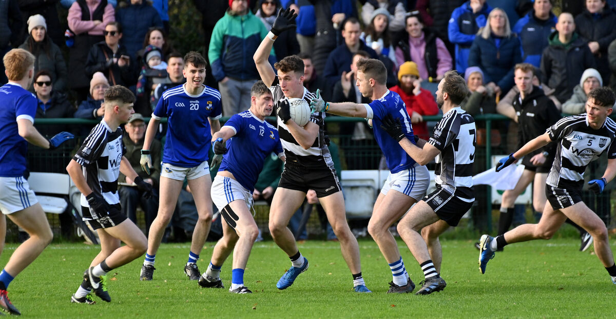Donoughmore's Seán O'Hanlon wins this midfield ball from Aghinagh players Shane Corkery and Gearóid O'Sullivan last year. Picture: Dan Linehan