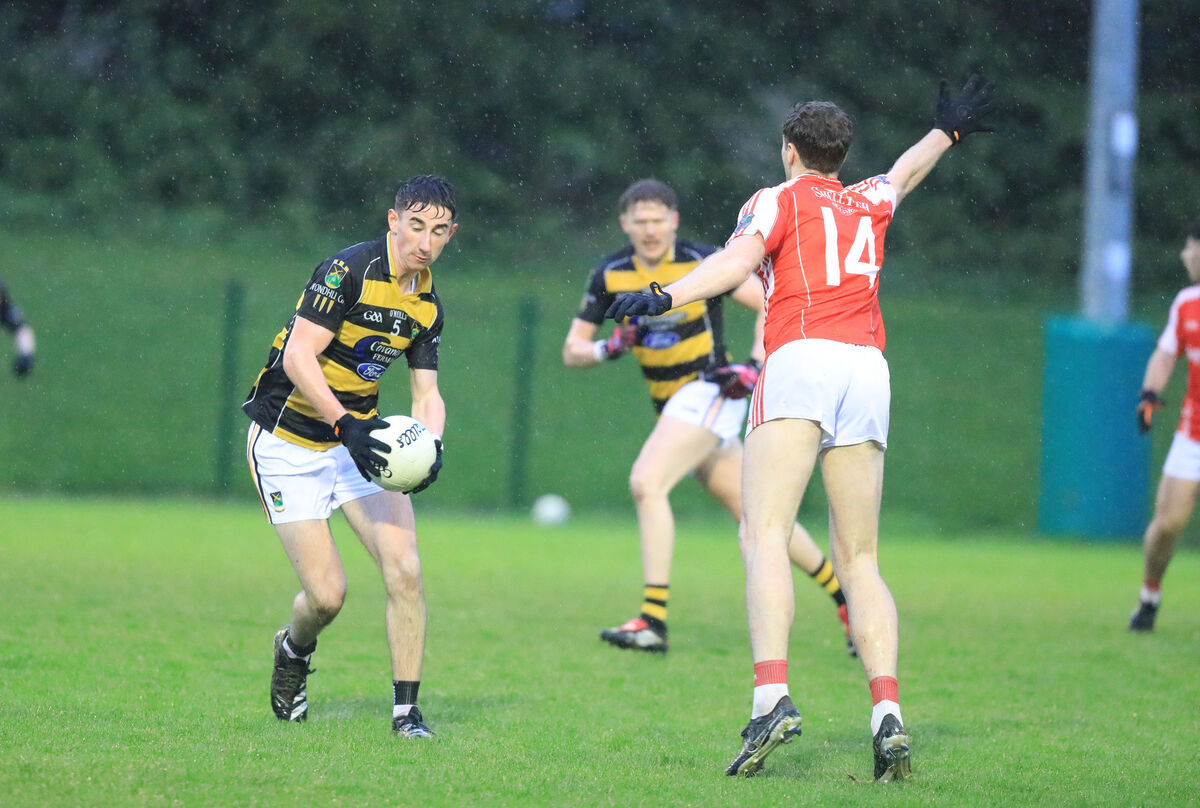 Avondhu's Aaron Trimm about to go around Beara's Brian Terry O'Sullivan. Picture: David Creedon