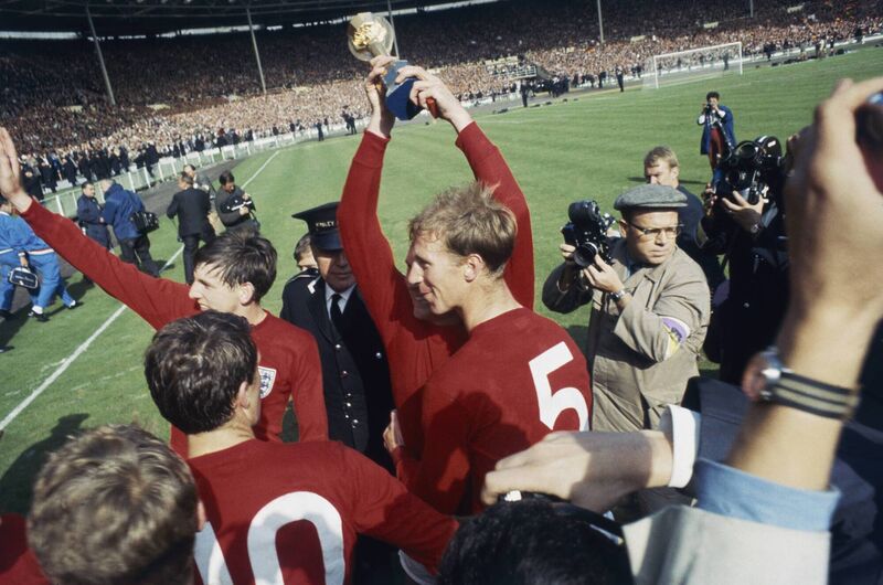 Martin Peters and Jack Charlton celebrate on the pitch after England's victory in the 1966 World Cup final at Wembley, on July 30 1966. Photo by Central Press/Hulton Archive/Getty Images
