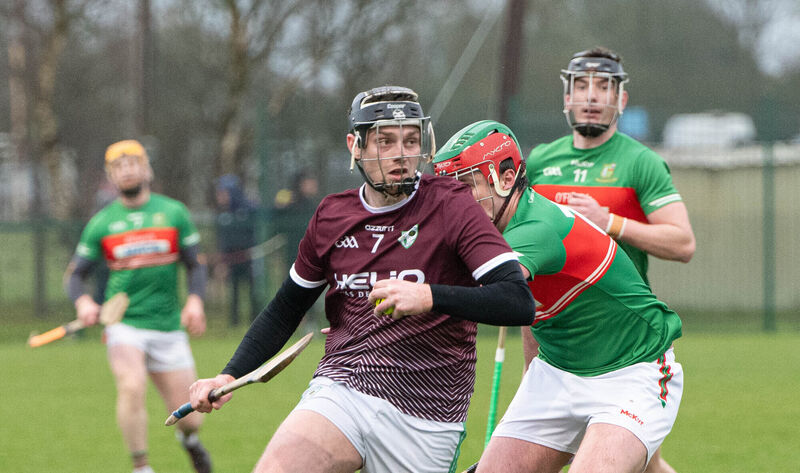 Killeagh's George Walsh Wallace looks for support as he breaks away from Fr O'Neill's Patrick Steele at Aghavine. Picture: Howard Crowdy