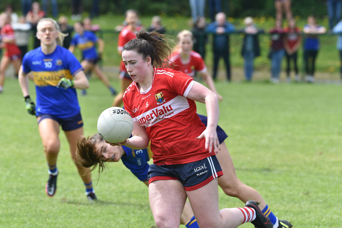 Shauna Kelly breaks past Maria Curley, Tipperary, during their Munster LGFA Senior Championship match at Cahir last year. Cork will open their Munster championship campaign against Tipperary next Saturday night at Páirc Uí Rinn, at 7pm. Picture:  Dan Linehan