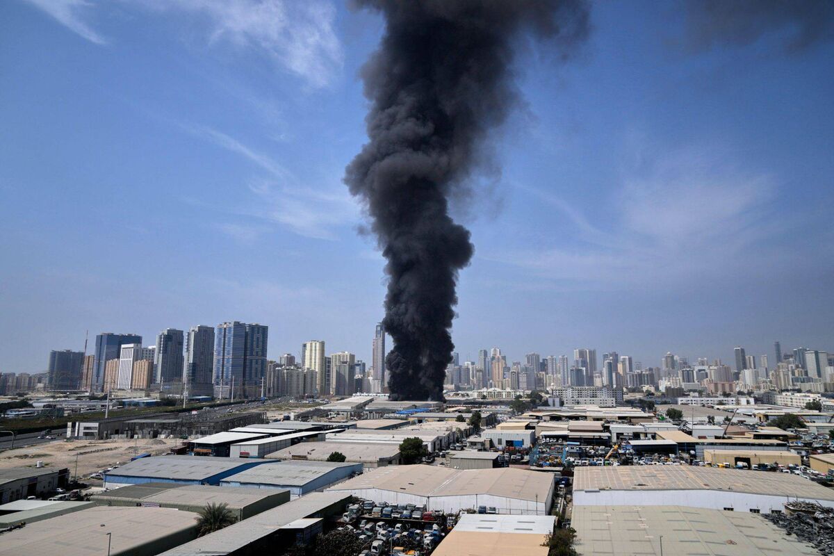A black plume of smoke rises from a warehouse at the industrial area of Sharjah City in the United Arab Emirates following reports of Iranian strikes in Dubai, United Arab Emirates on March 1. (Picture: AP Photo/Altaf Qadri)