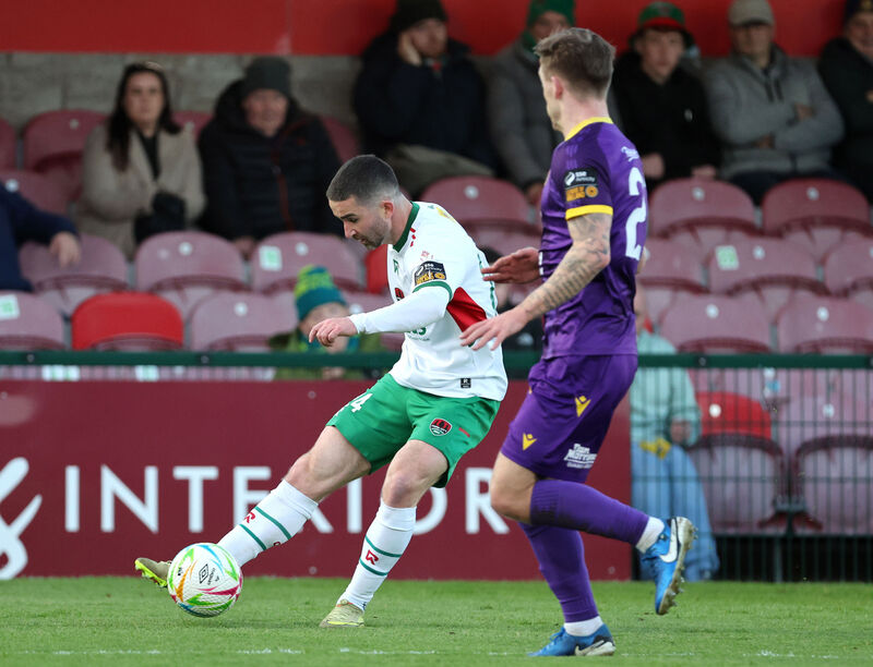  Seani Maguire, Cork City FC, in action against Dylan Hand, Wexford FC. Picture: Jim Coughlan.