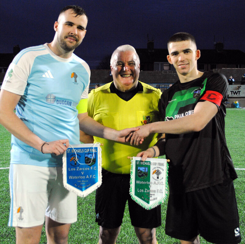 Los Zarcos captain Pa Dineen exchanges pennants with Waterloo's Jack Homan, watched by referee Jim Hennessy, before a recent game. Picture: Barry Peelo.