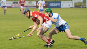 <p>Cork captain Barry O'Flynn tries to claim possession despite the attentions of Waterford's Tomás Ahern during Wednesday's Fulfil Munster U20HC clash at Cappoquin Logistics Fraher Field. Picture: Howard Crowdy</p>