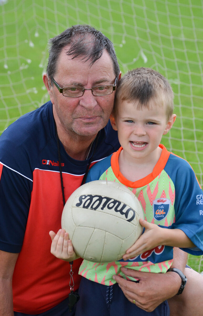Coach Tony Hegarty pictured with his grandson Luke Hegarty at the recent Cul Camp at Mayfield GAA Club. Picture: Howard Crowdy