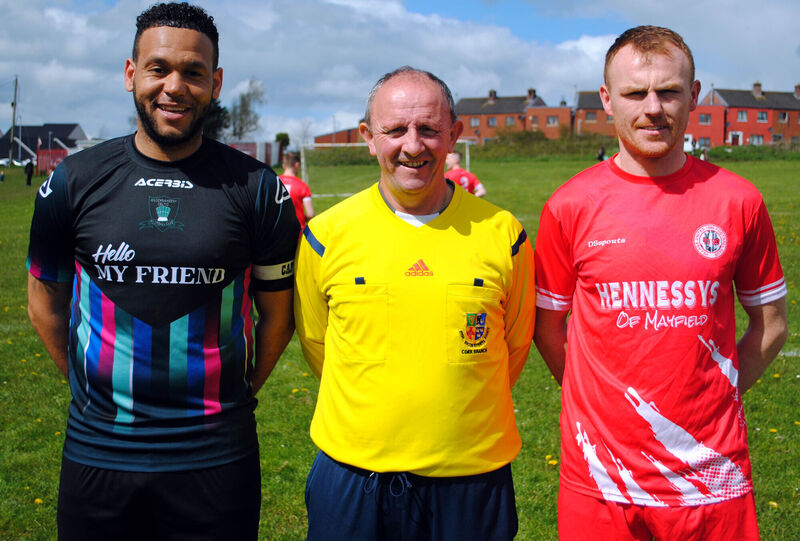Village United captain Anthony Kiniry (right), with Knocknaheeny Celtic's Chris Akhigbe, accompanied by referee Paul Bowdren.