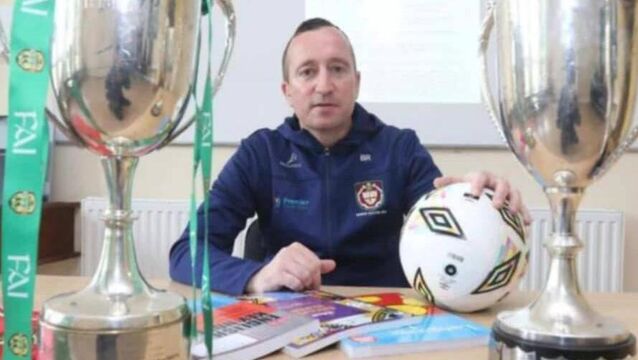 <p>Barry Ryan pictured with Munster and All-Ireland schools cups</p>