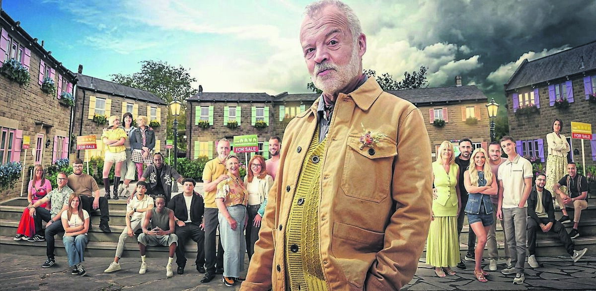 Graham Norton with family contestants taking part in new series The Neighbourhood. 