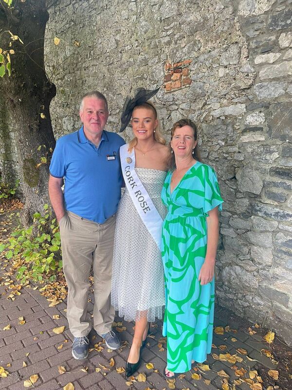 Nancy with her parents. She has four brothers and is the second eldest in her family.