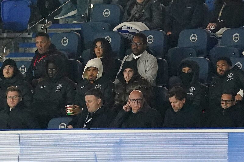 Chelsea's Cole Palmer (centre) watches on from the stands during the Premier League match at the American Express Stadium, Brighton. Picture date: Tuesday April 21, 2026. Picture: Gareth Fuller/PA Wire