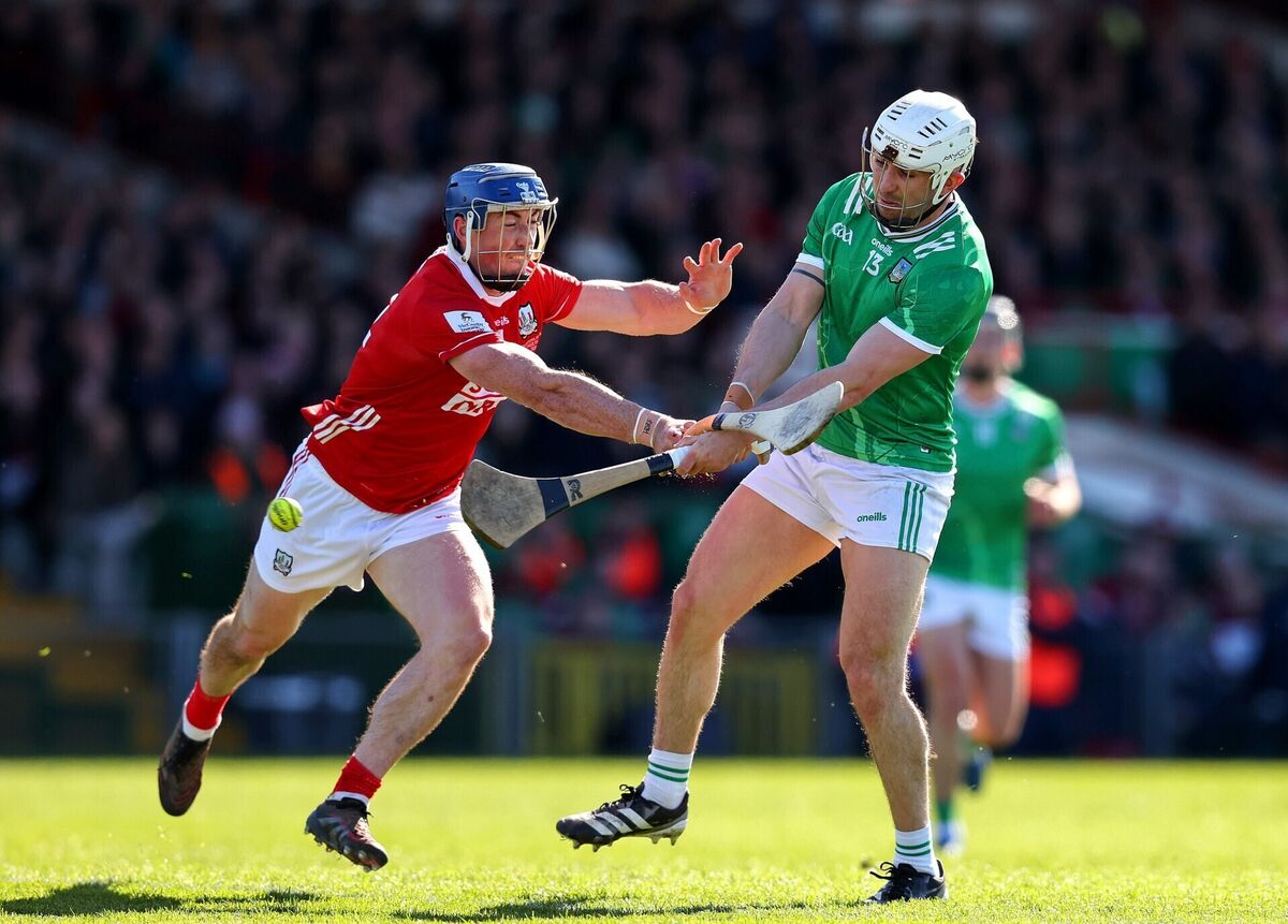 Limerick's Aaron Gillane scores a goal ahead of Seán O'Donoghue of Cork. Picture: INPHO/Tom O’Hanlon