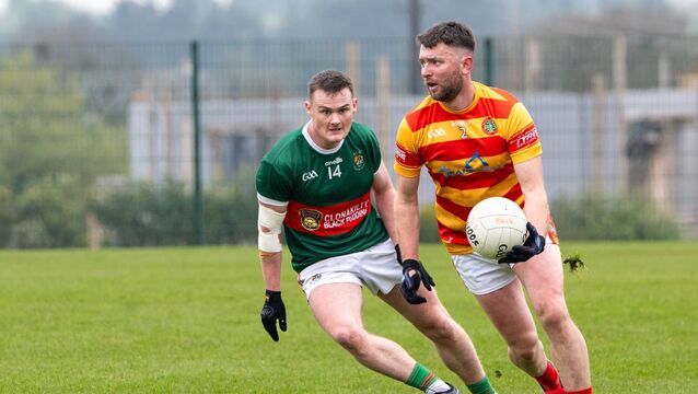 <p> Clonakilty's Conor Daly closes in on James Kelleher, Newcestown. Picture: Chani Anderson</p>