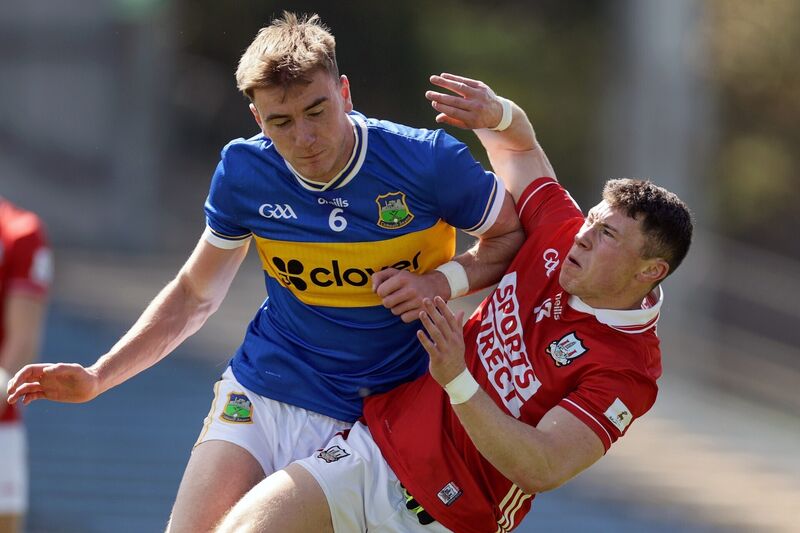 Tipperary's James Morris collides with Mark Cronin of Cork. Picture: INPHO/Laszlo Geczo