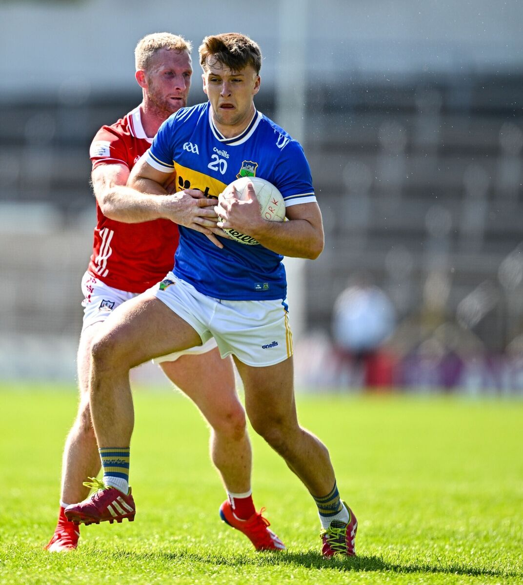 Paddy Creedon of Tipperary is tackled by Ruairí Deane of Cork. Picture: Sam Barnes/Sportsfile