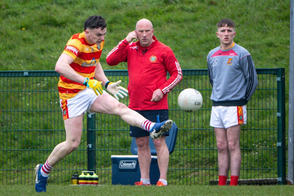 Newcestown's Seán Donovan fires shot watched by manager Jim O'Sullivan. Picture: Chani Anderson