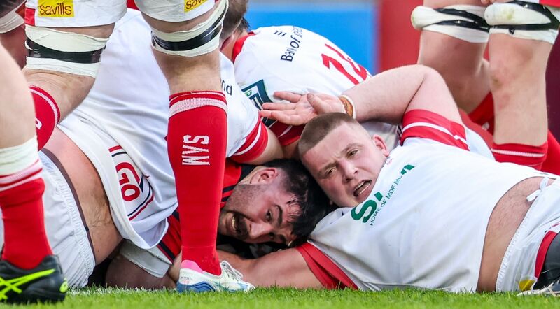 Munster's John Hodnett scores his sides fifth try of the match despite Ulster's Bryan O'Connor 