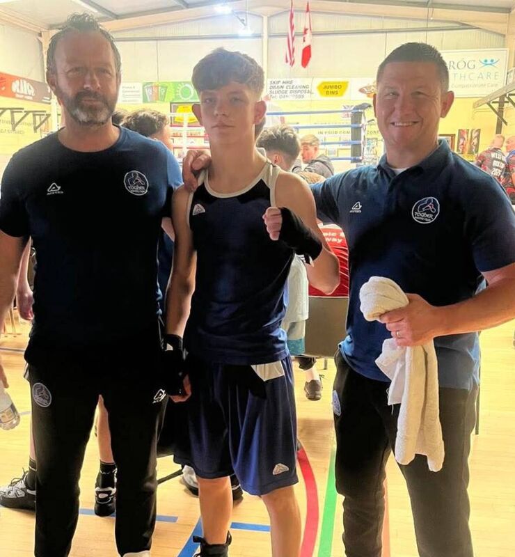 Togher BC coaches Ian Power and Andrew Thornton with their boxer Michael O'Reilly, who won his box off to represent Ireland at the upcoming Four Nations international tournament. 