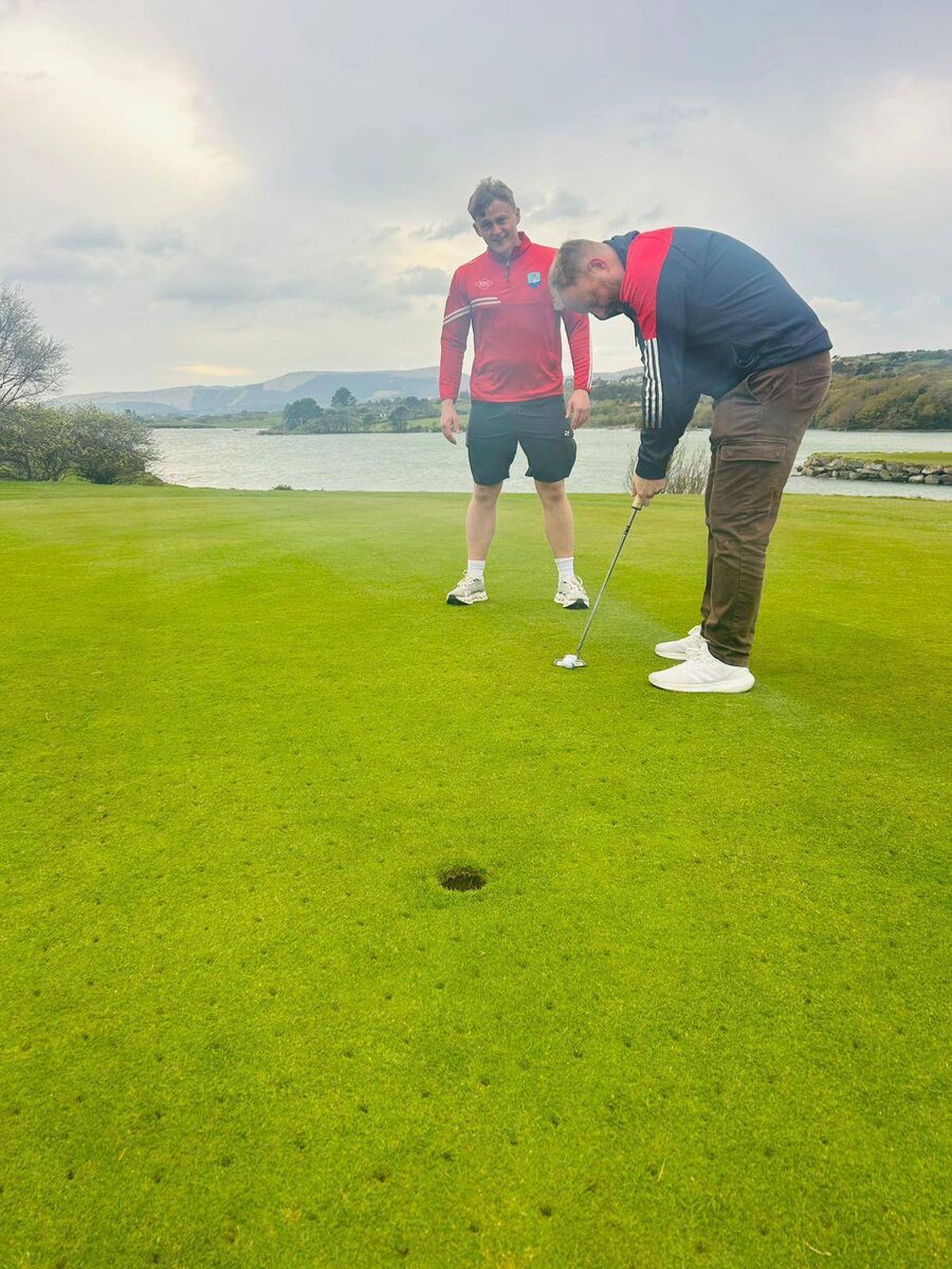 Adrigole selector Paul Goggin getting in some practice under the watchful eye of Adrigole player Charlie Joe O'Sullivan. The Adrigole Golf Classic will take place in Berehaven Golf Club on Friday May 22nd, Saturday May 23rd and Sunday May 24th.