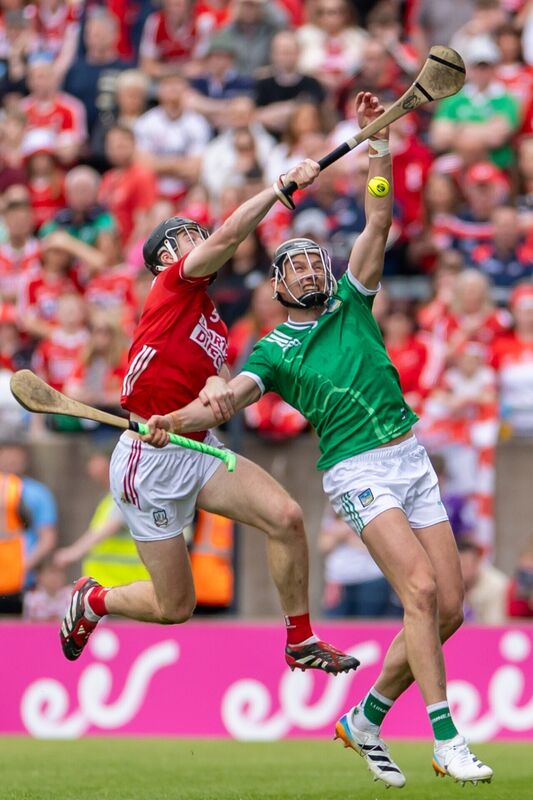 Cork’s Eoin Downey breaks the sliotar from Gearóid Hegarty of Limerick. Picture: INPHO/Morgan Treacy