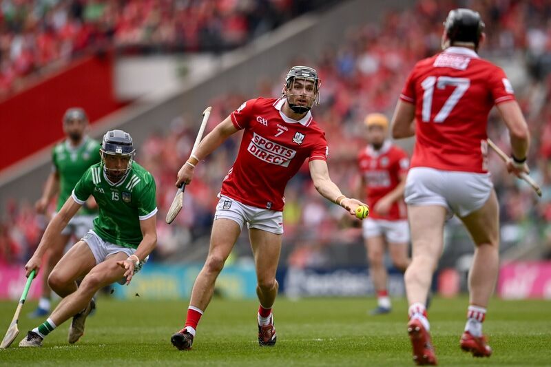 Mark Coleman hand passes to Cork team-mate Damien Cahalane. Pictrue: Tom Beary/Sportsfile