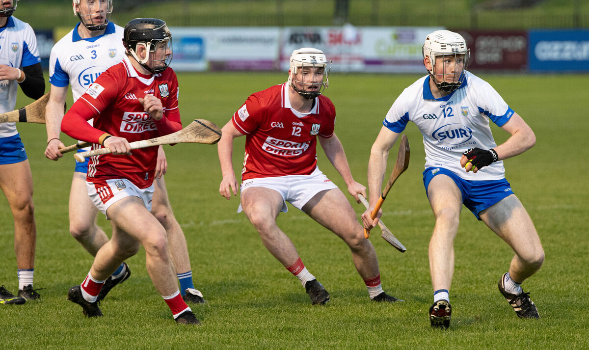 Cork's Jack O'Brien and Finn O'Brien put pressure on Waterford's Jack Power during the game at Cappoquin Logistics Fraher Field. Picture: Howard Crowdy