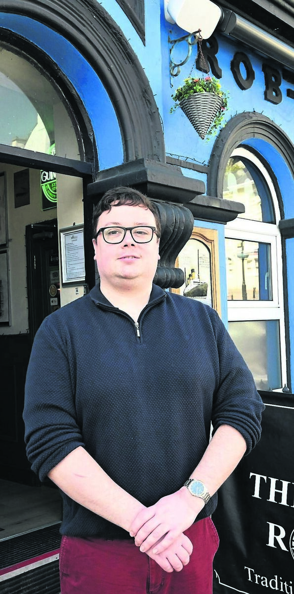 Eoin McCarthy outside his pub, the Rob Roy Bar, in Pearse Square, Cobh. He says: “When the cruise ships arrive, there is always a buzz.” Picture: Larry Cummins