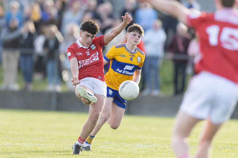 Cork's Joe Miskella and Clare's Tristan O'Loughlin in action. Picture: Eamon Ward