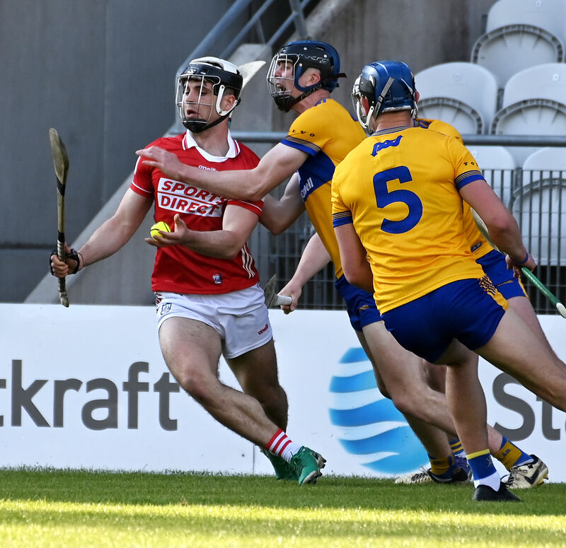 Cork's Barry Walsh tackled by Clare's Matthew O'Halloran and Jamie Moylan. Picture: Eddie O'Hare