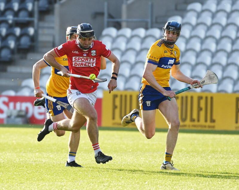 Cork's Ben Walsh racing towards goal as Clare's Matthew O'Halloran chases. Picture: Eddie O'Hare